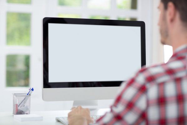 depositphotos 50728209 stock photo man in front of computer Економічні новини